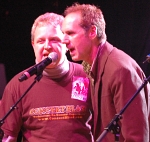 Mike singing on stage with Kelly Keagy of Night Ranger