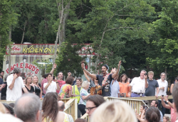 Michael Franti Performing in the Crowd